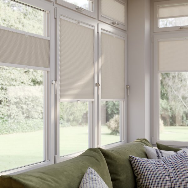 photo of table with white house plant on top next to window using brown perfect fit&reg; blinds 