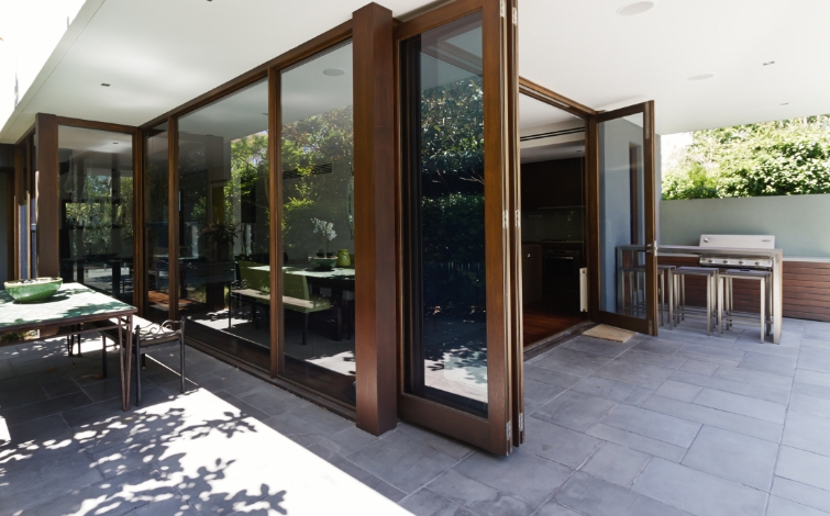 photo of patio with open bi fold doors to show example of where to fit bifold door blinds 
