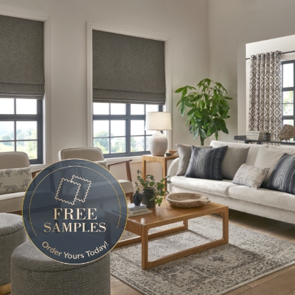 What materials are grey Roman blinds available in?