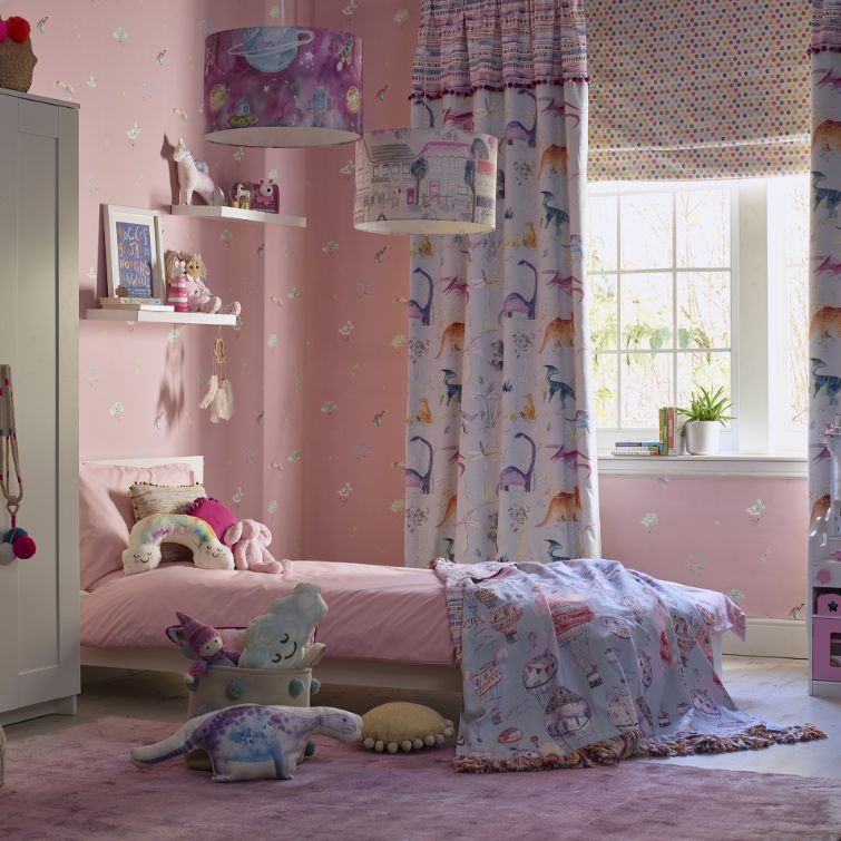 room set image of a pink girls room with bed next to large window and children's curtains with dinosaur print