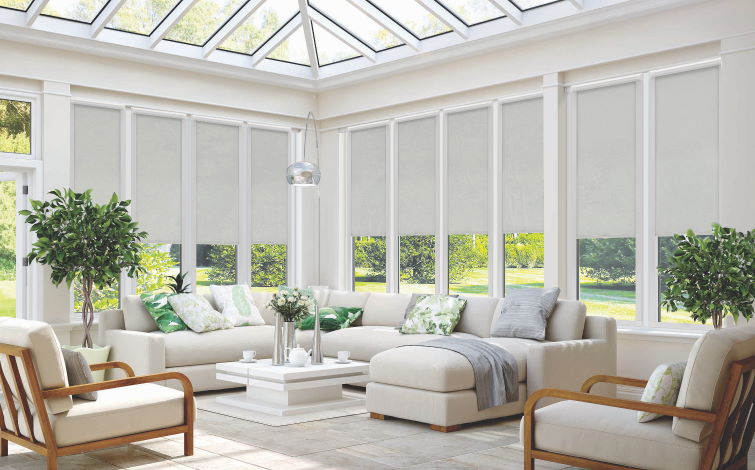 Photo of sofas in conservatory using conservatory blinds on windows