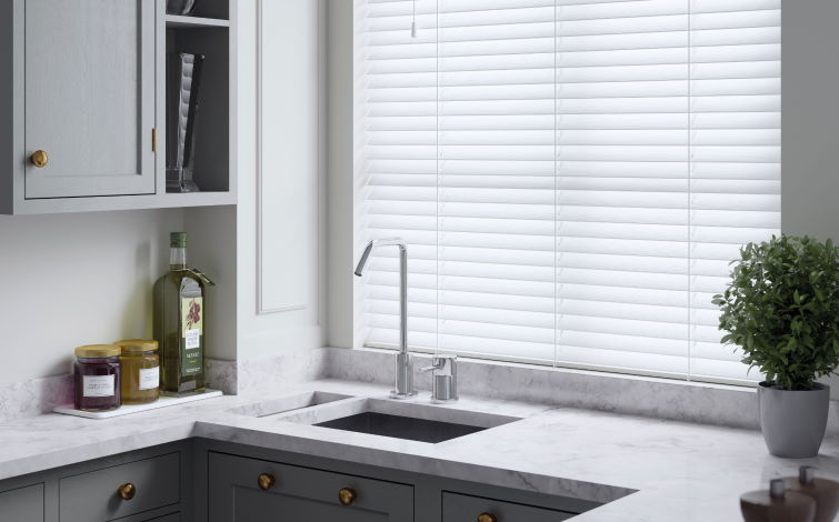 Close up image of window with kitchen blinds attached