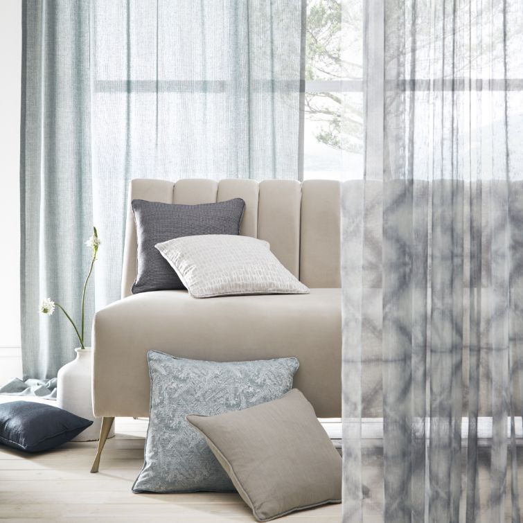 image to show how to use voile pinch pleat curtains in a coastal inspired interior 
