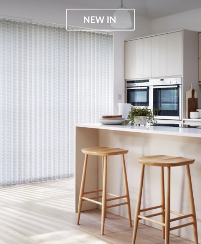 Vertical Blinds in a kitchen with barstools and natural lighting