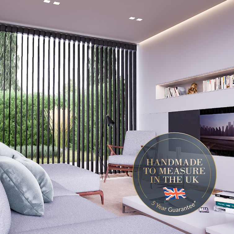 image of living room with grey corner sofa infront of tv and grey chair next to tall window with black illusion blinds