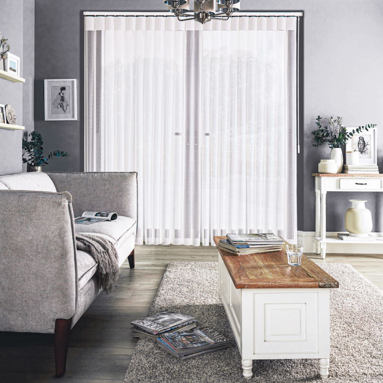 photo of grey sofa in room with french doors and grey illusion blinds infront