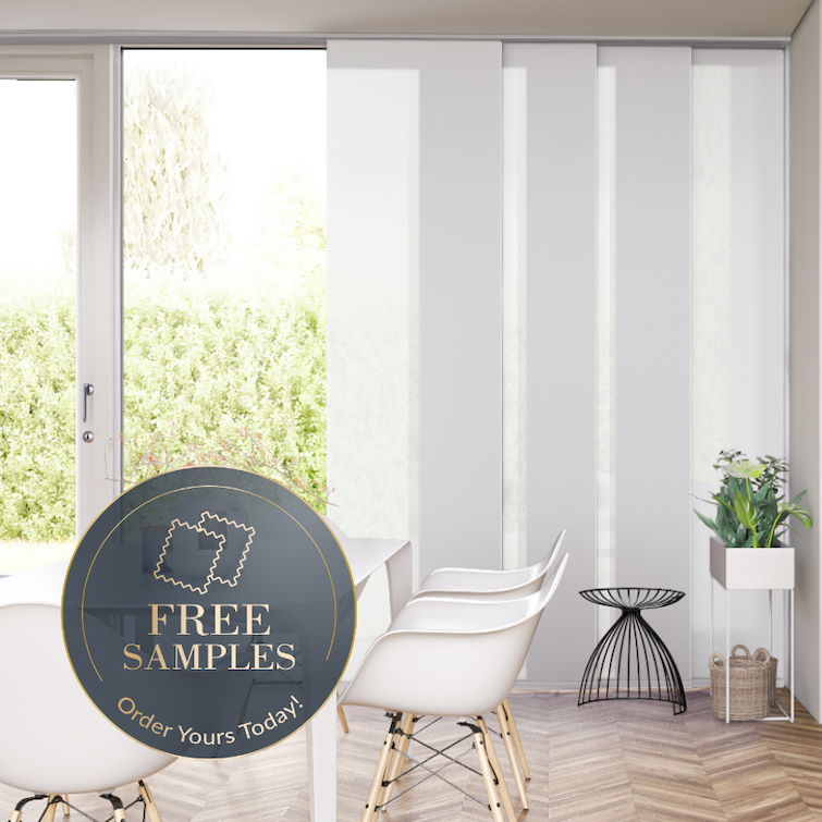 photo of large table with white chairs next to large window with hanging white panel blinds