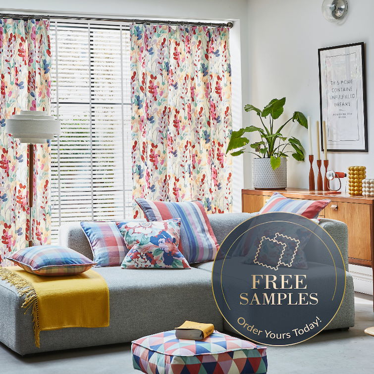 promotion image of living room with grey sofa and floral curtains to show free samples available from blinds direct